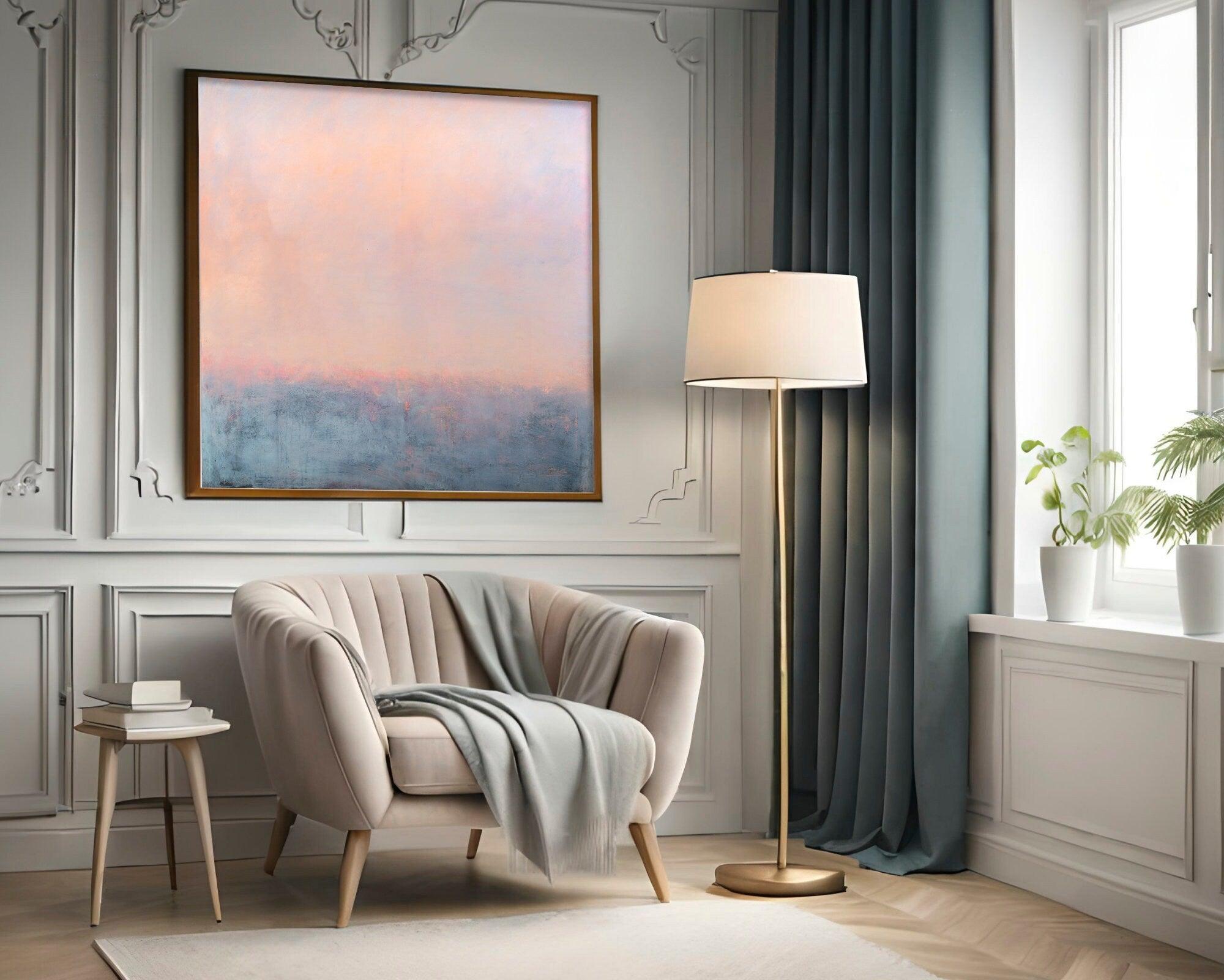 The stunning combination of a modern chair placed against a backdrop of a peach and blue landscape is sure to leave you mesmerized. And that's not all - the cherry on top is the original abstract painting by the talented Camilo Mattis.